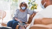 Female patient speaks with doctor